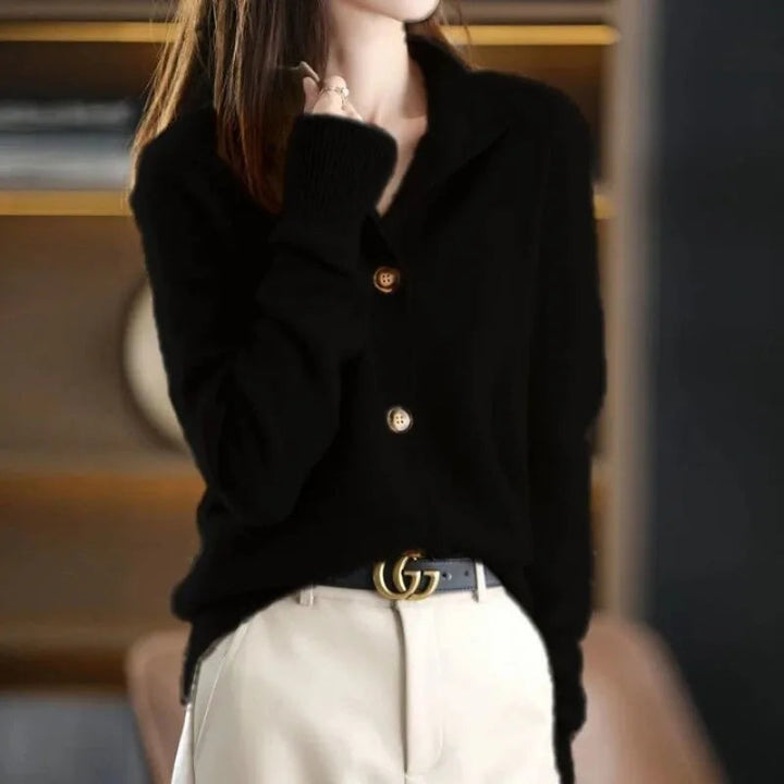 Black women's button-front cardigan sweater. Versatile layering piece with a relaxed fit for elegant style.