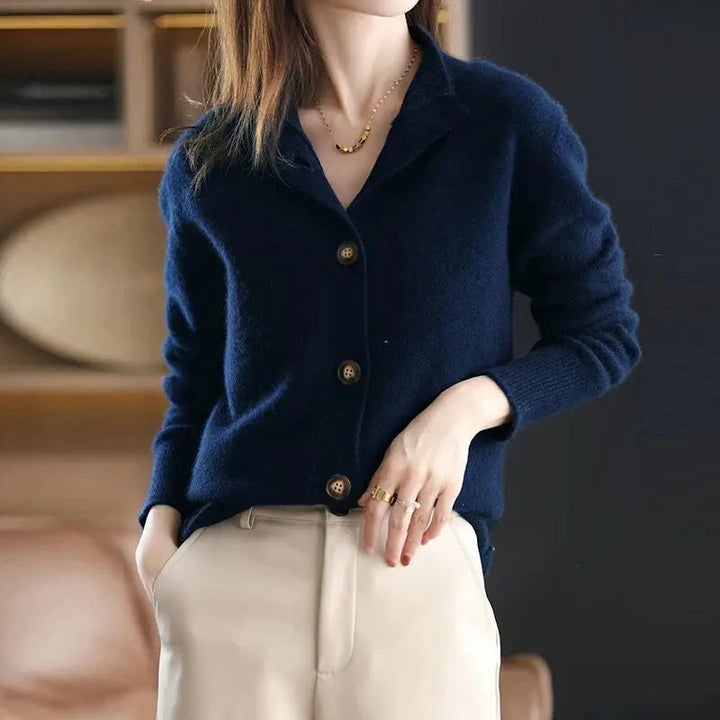 Navy women's cozy knit button cardigan. Elegant and chic sweater, ideal for versatile fashion and layering.