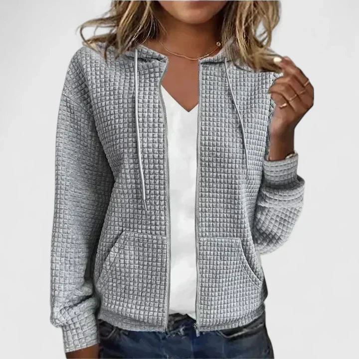 Fashionable women's open-front draped cardigan, an essential long sleeve top for elegant casual wear.