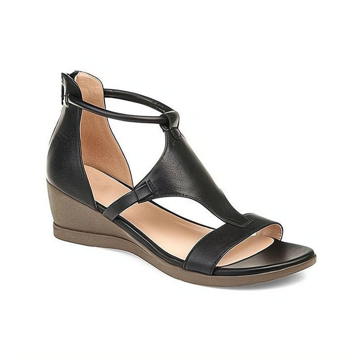 Detailed view of chic women's flat sandals. Slip-on everyday footwear for ultimate summer comfort.