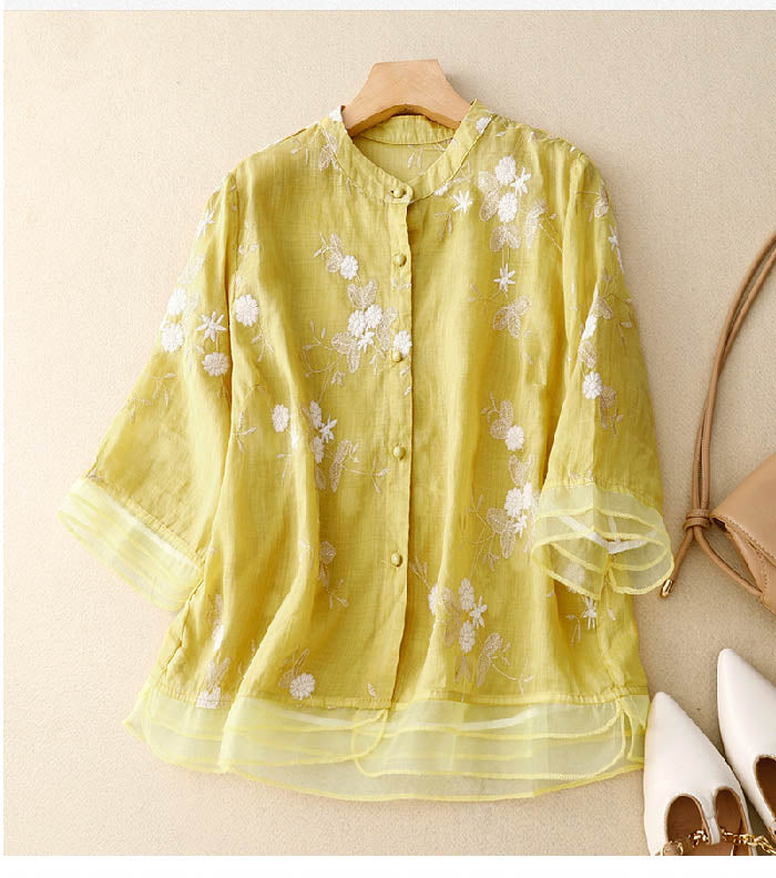 Unique floral patchwork long-sleeve blouse for women, elegant button-front top, chic and comfortable.