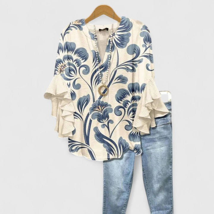 Women's chic floral blouse with elegant ruffled sleeves, perfect for a stylish everyday look.