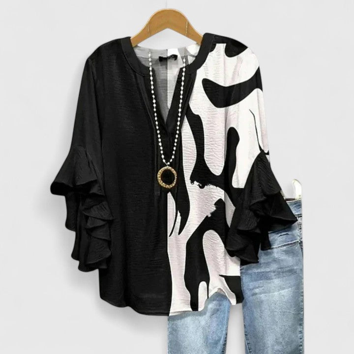 Vibrant floral print women's blouse with fashionable ruffled sleeves, adding flair to your outfit.