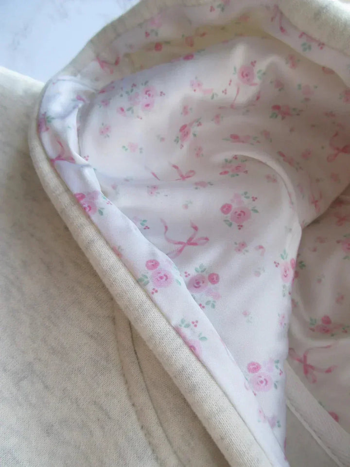 Stylish women's hoodie with elegant bow detail, comfortable relaxed fit, perfect for chic casual fashion.