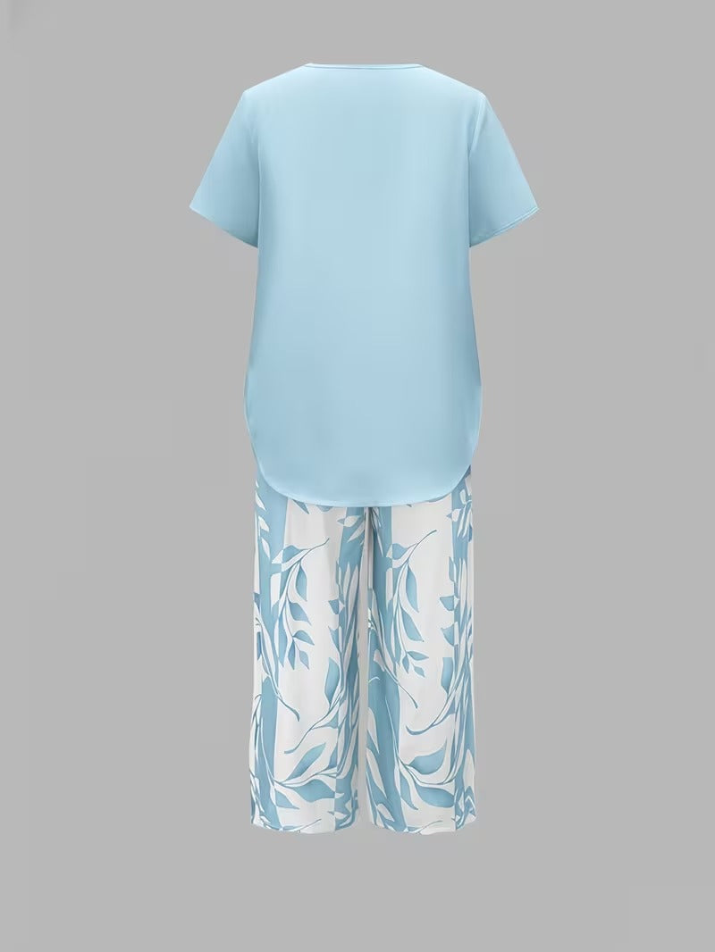 Chic women's leaf print two-piece summer outfit set, versatile and comfortable for warm weather.