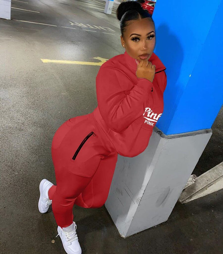 Complete women's letter print track suit. Stylish two-piece loungewear set for versatile casual wear.