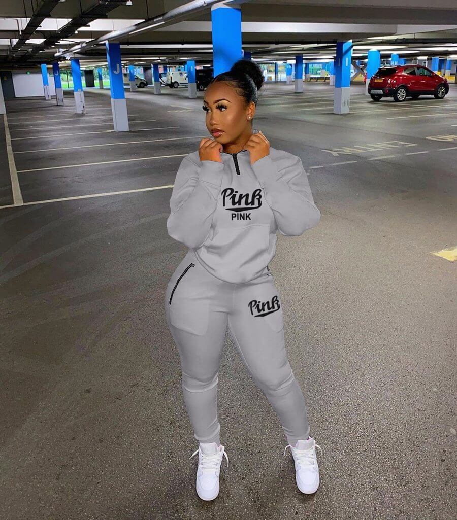 Chic women's two-piece set with letter print. Comfortable pullover & jogger for stylish loungewear.