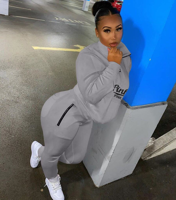 Women's letter print two-piece loungewear. Chic matching set with pullover and joggers for comfort.