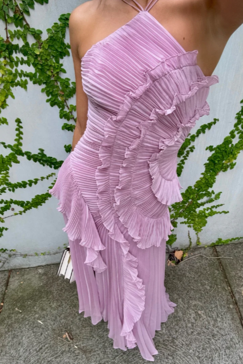 Chic mauve pleated maxi dress with a sophisticated ruffle halter neckline, ideal for evening events.
