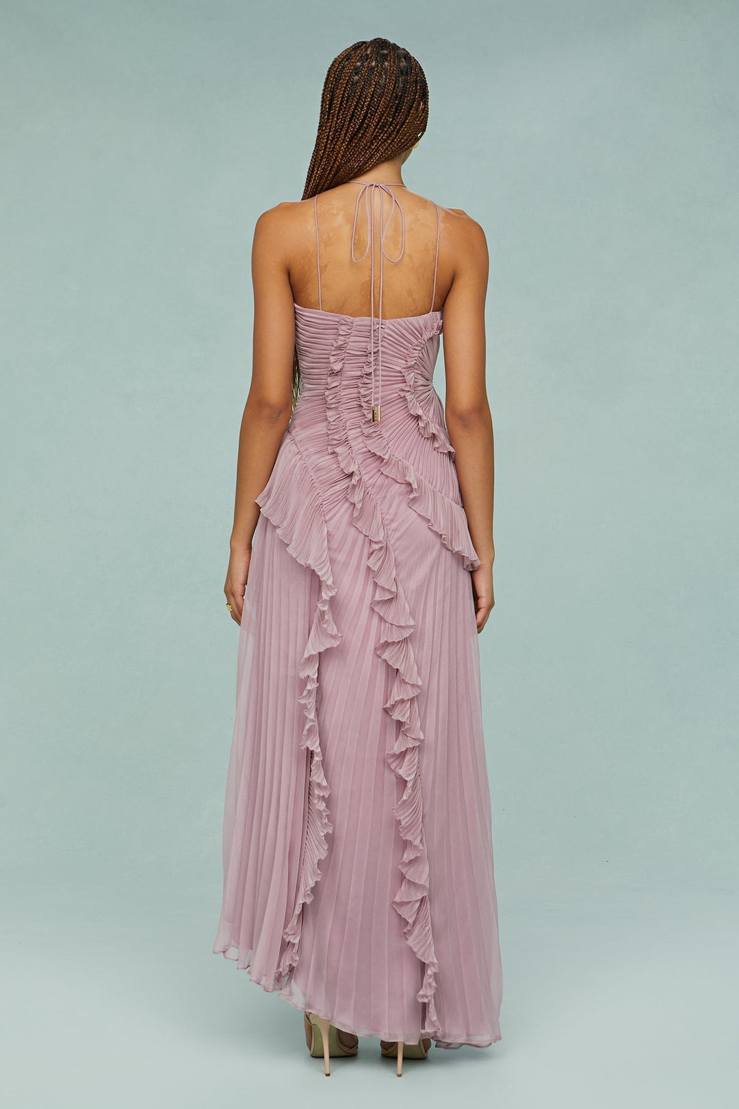 Flowy women's maxi dress in elegant mauve, featuring a halter neck and ruffle detail, ideal for wedding guests.