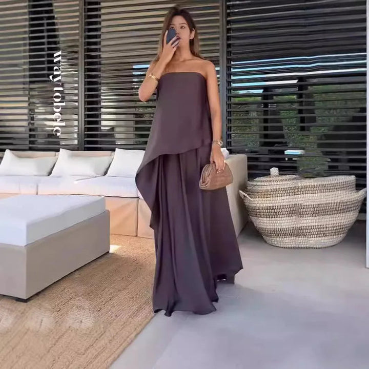 Elegant women's matching set: off-shoulder blouse and long skirt outfit, ideal for versatile day-to-night styling.