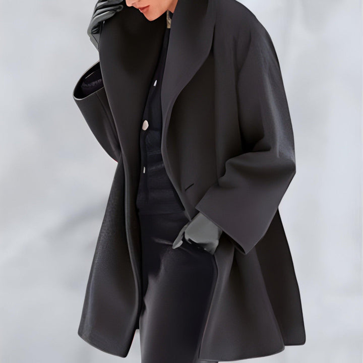 Elegant long oversized coat for women. A chic layering piece suitable for fall, winter, and spring outerwear.