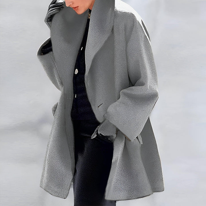 Stylish women's oversized long coat offering chic comfort. Perfect outerwear for a trendy fall or winter look.