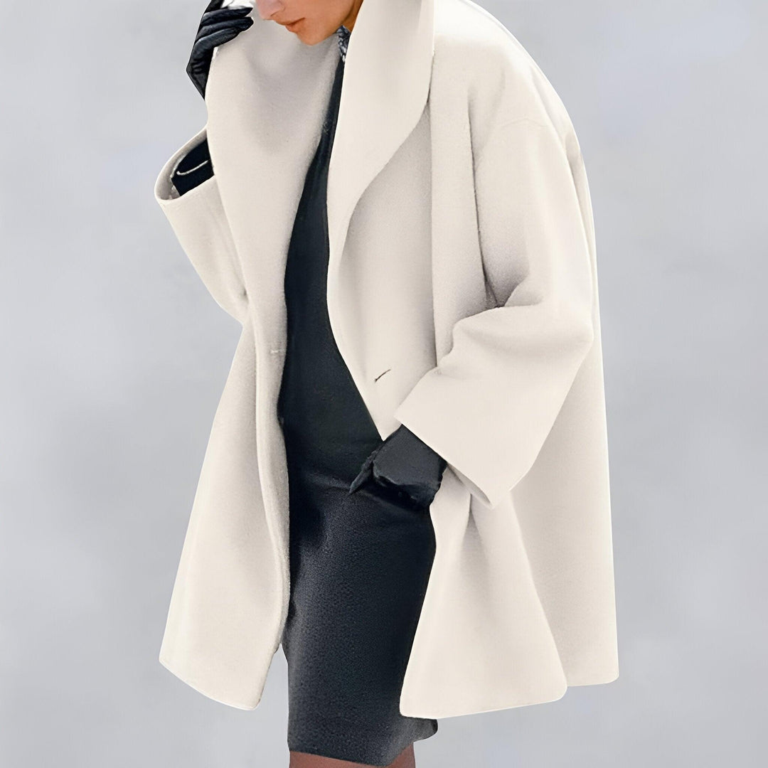 Chic women's oversized outerwear. An elegant long coat designed for versatile fall, winter, and spring fashion.