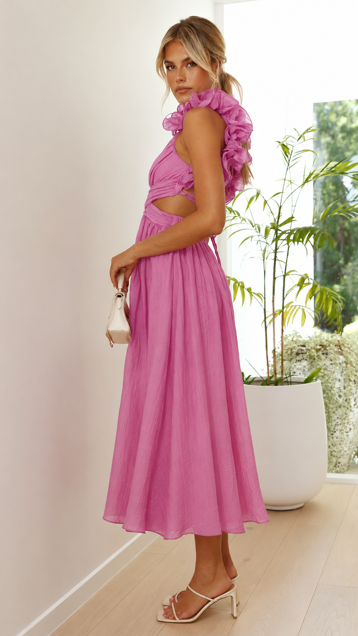 Elegant pink lace-up maxi dress featuring feminine ruffles & open back. Ideal for a chic wedding guest look.