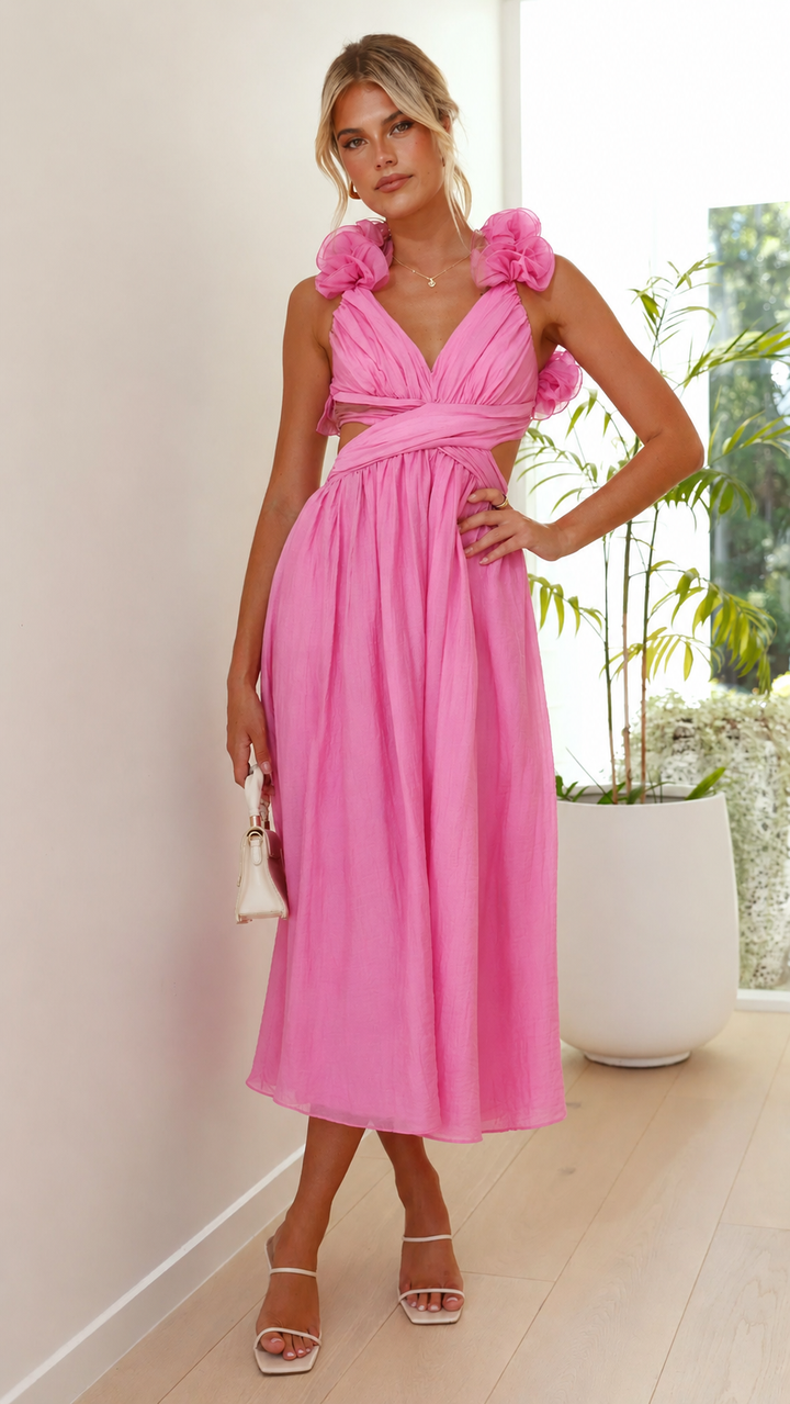 Chic feminine pink maxi dress with delicate ruffles & an adjustable lace-up back, suitable for formal events.