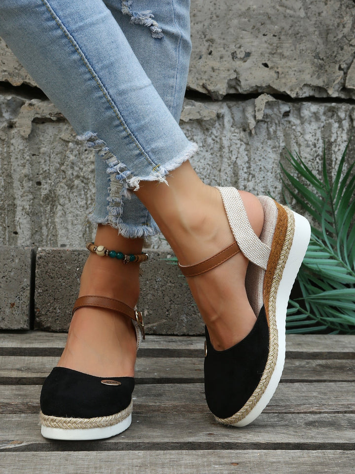 Fashionable women's platform espadrille sandals with woven jute sole, perfect for summer vacations.