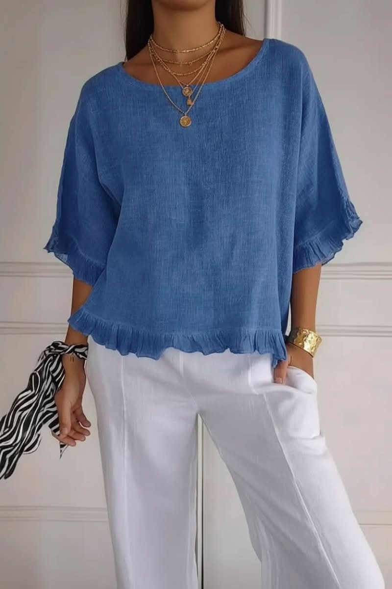 Women's chic ruffle blouse with elegant details, perfect for versatile summer and office wear.