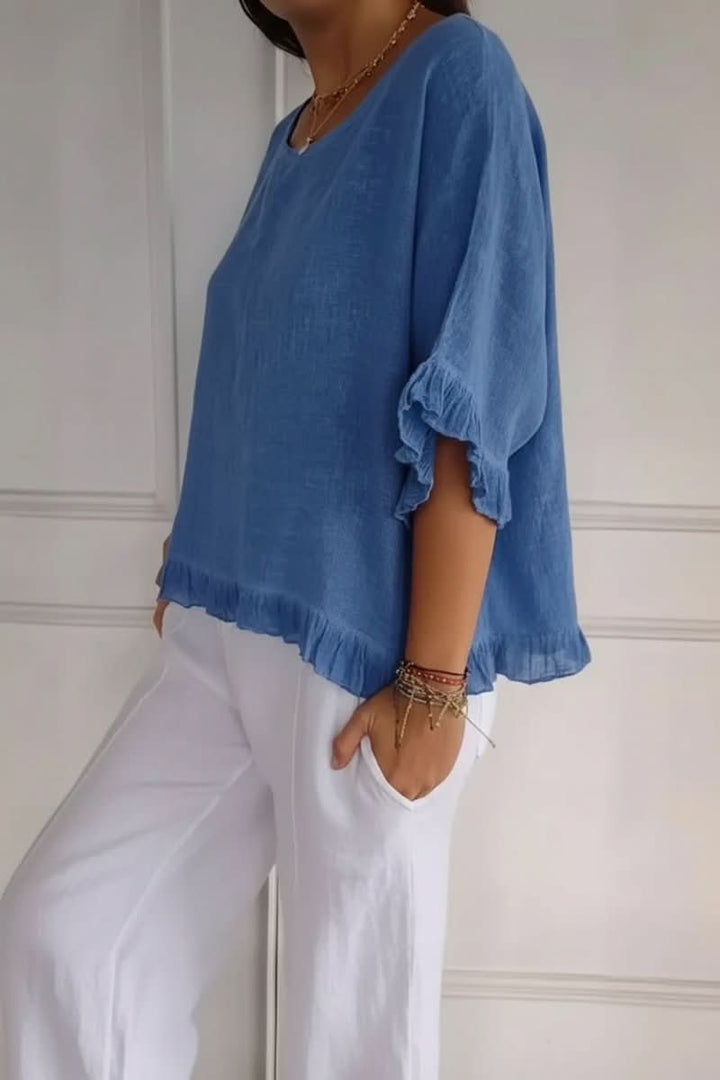 Flattering women's ruffle top, a chic and lightweight blouse for effortless casual or office style.