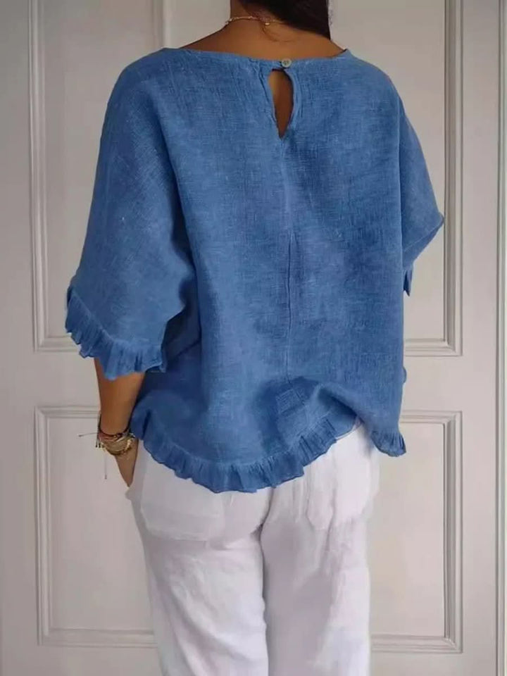 Versatile women's elegant ruffle blouse, ideal for chic summer fashion or smart office wear.