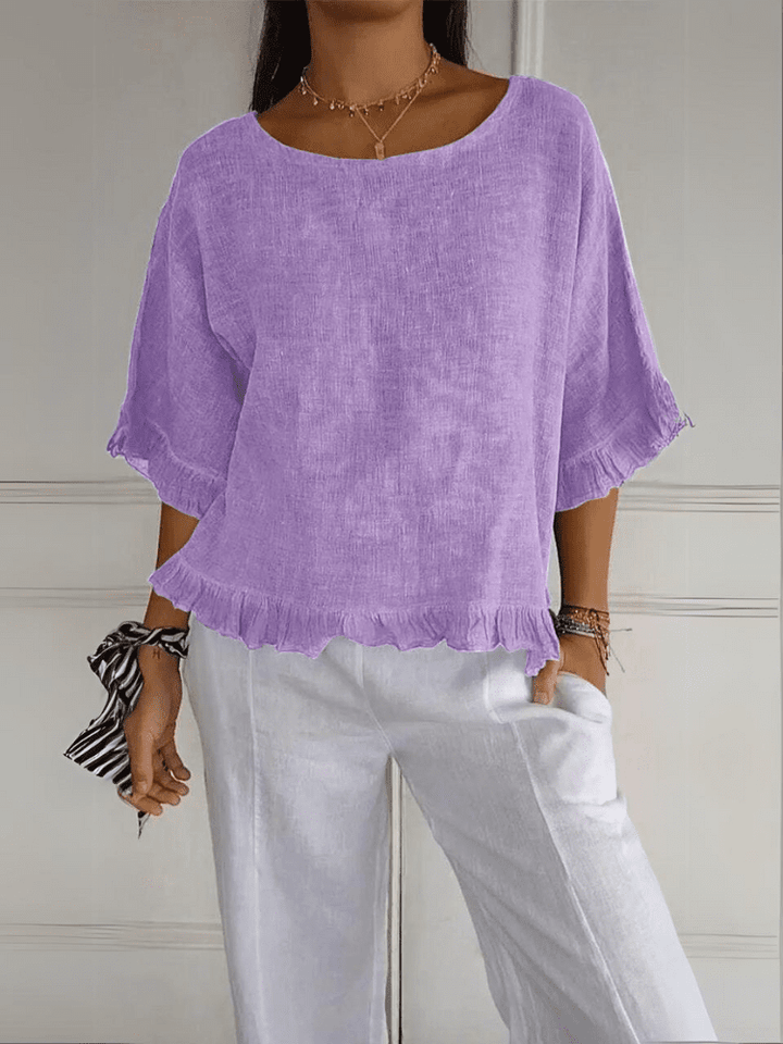Comfortable women's chic ruffle blouse, a lightweight and elegant top for easy summer or office style.