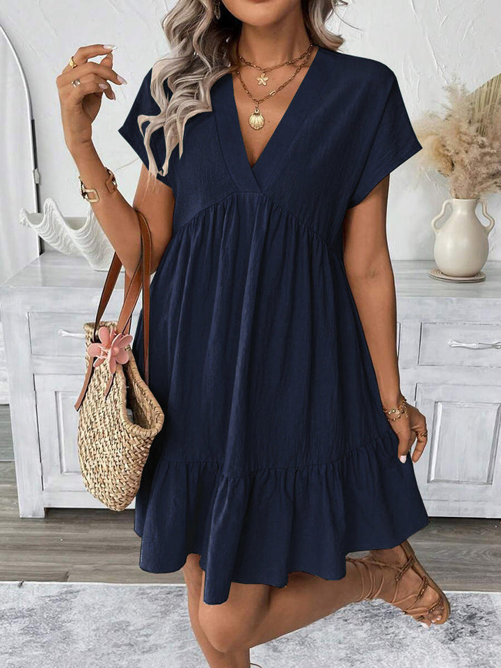 Trendy women's sleeveless mini dress with a stylish ruffle hem. Ideal for summer casual wear, beach days, or vacation.