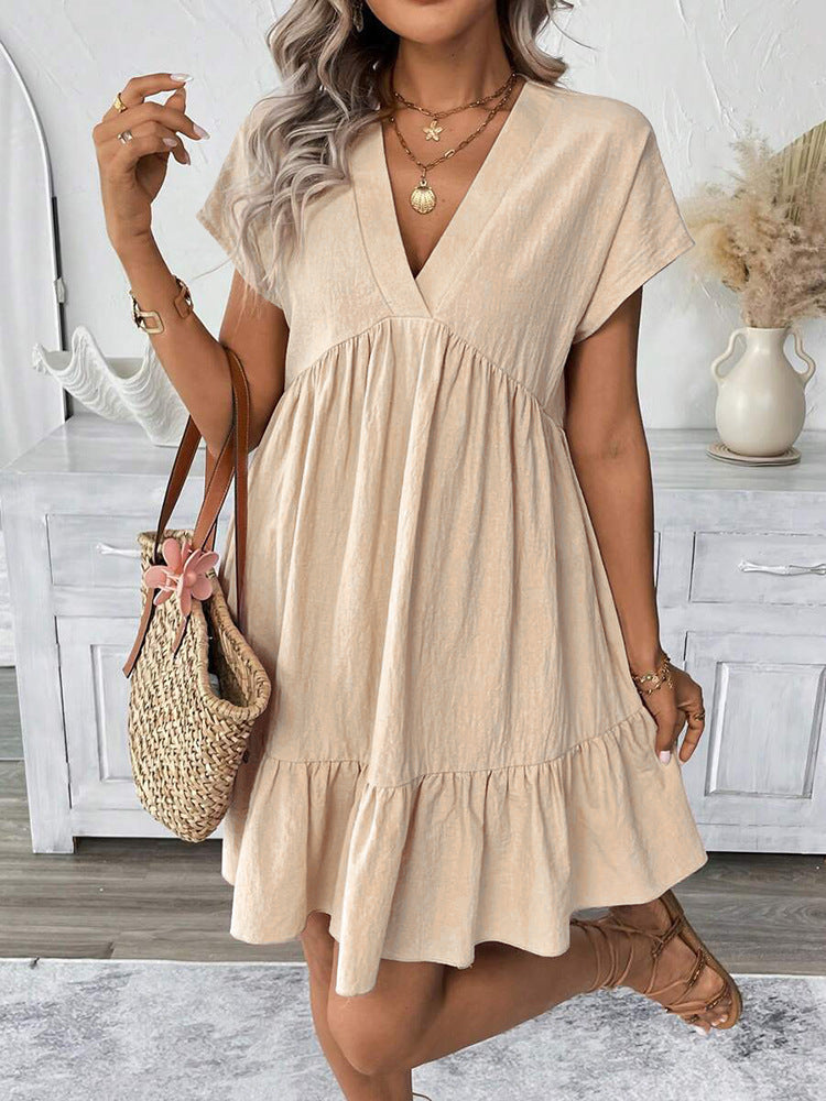 Fashionable women's chic mini dress with a playful ruffle hem. Versatile sleeveless V-neck style for summer & holidays.