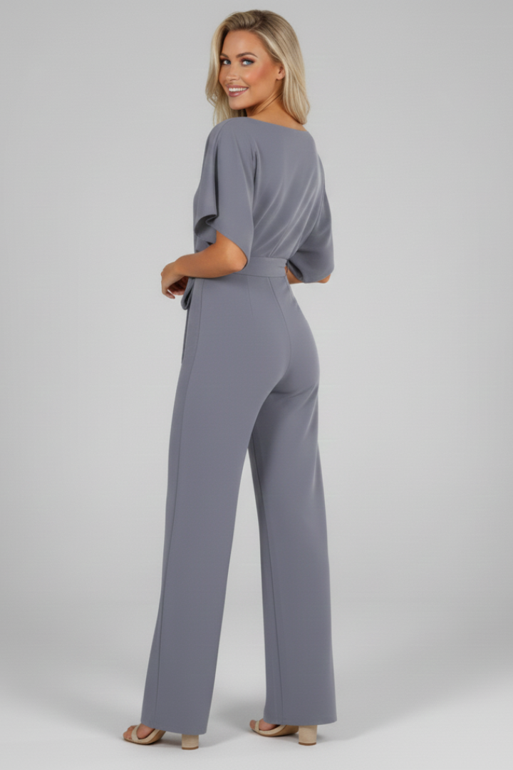 Modern women's summer short sleeve jumpsuit, featuring a flattering tie waist for a chic one-piece look.