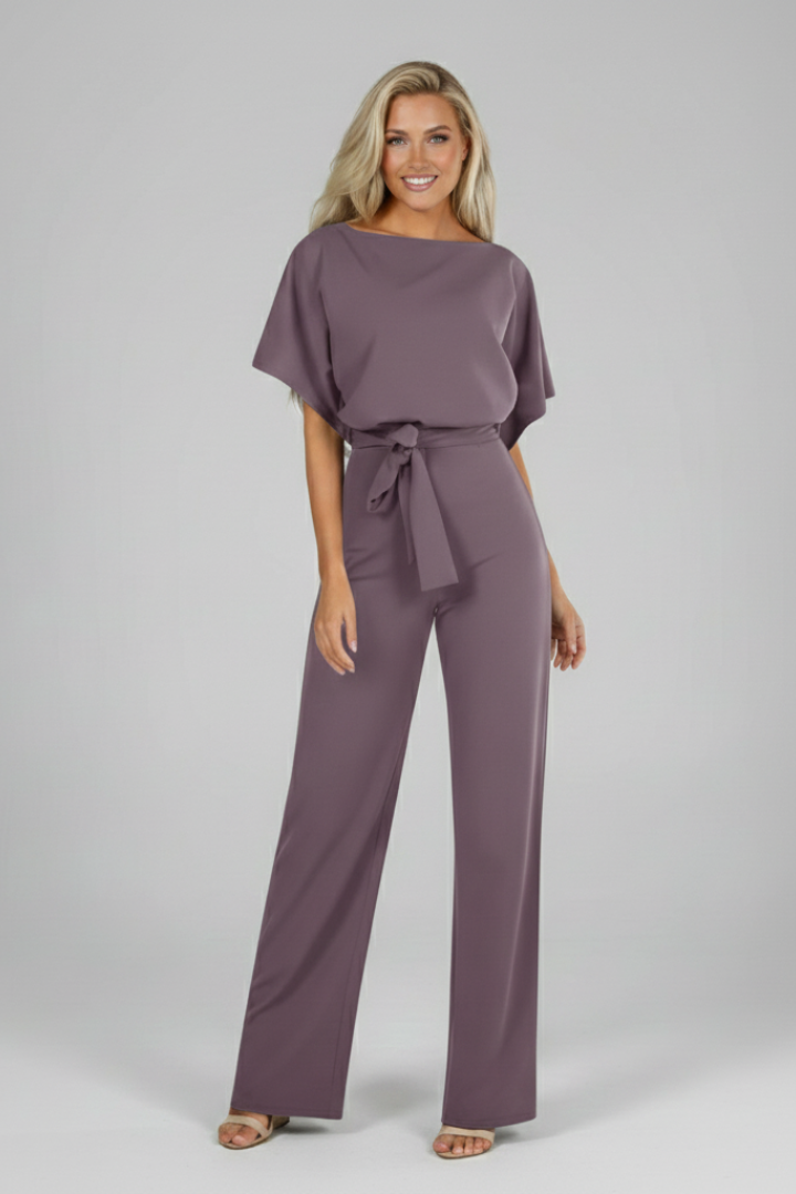 Fashionable women's short sleeve jumpsuit, complete with a flattering waist tie for a comfy and chic summer look.