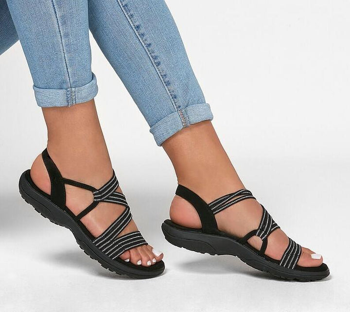 Women's chic slip-on sandals, ideal for everyday comfort. Features lightweight, cushioned design for summer wear.