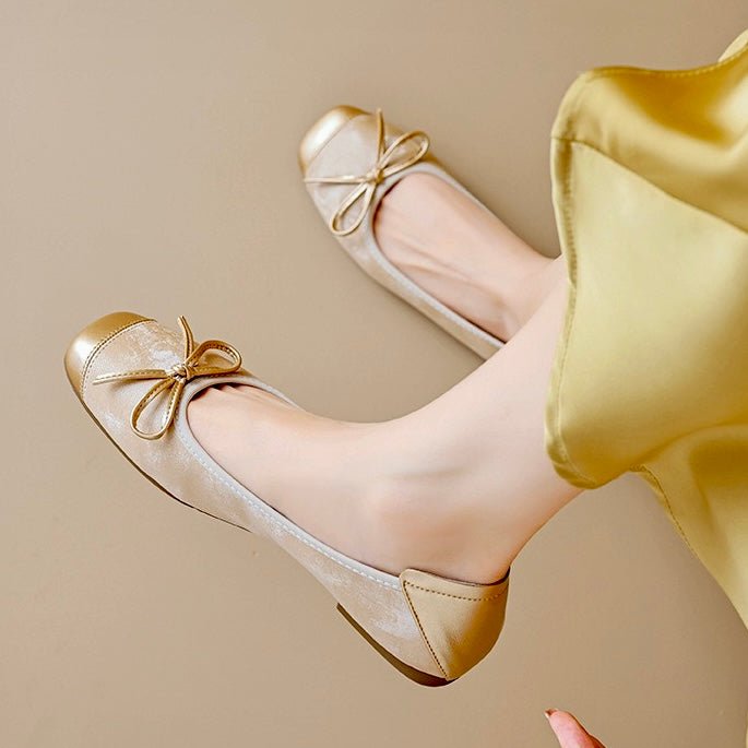 Classic women's slip-on ballet flats, featuring a comfortable square toe and elegant bow detail, a timeless choice.