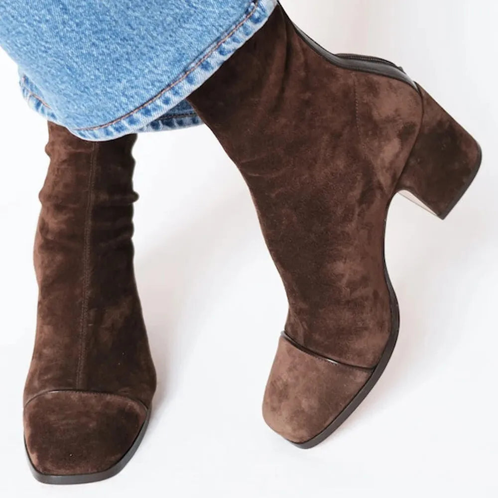 Women's chic square toe heeled ankle boots with a stylish block heel. Modern and versatile.