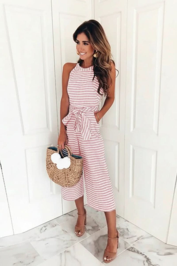 Women's chic striped belted jumpsuit with halter neck. Perfect elegant one-piece for versatile summer fashion.