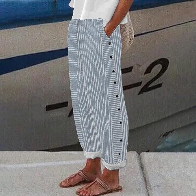 Comfortable women's striped trousers, relaxed fit, featuring stylish button accents & an elastic waist.