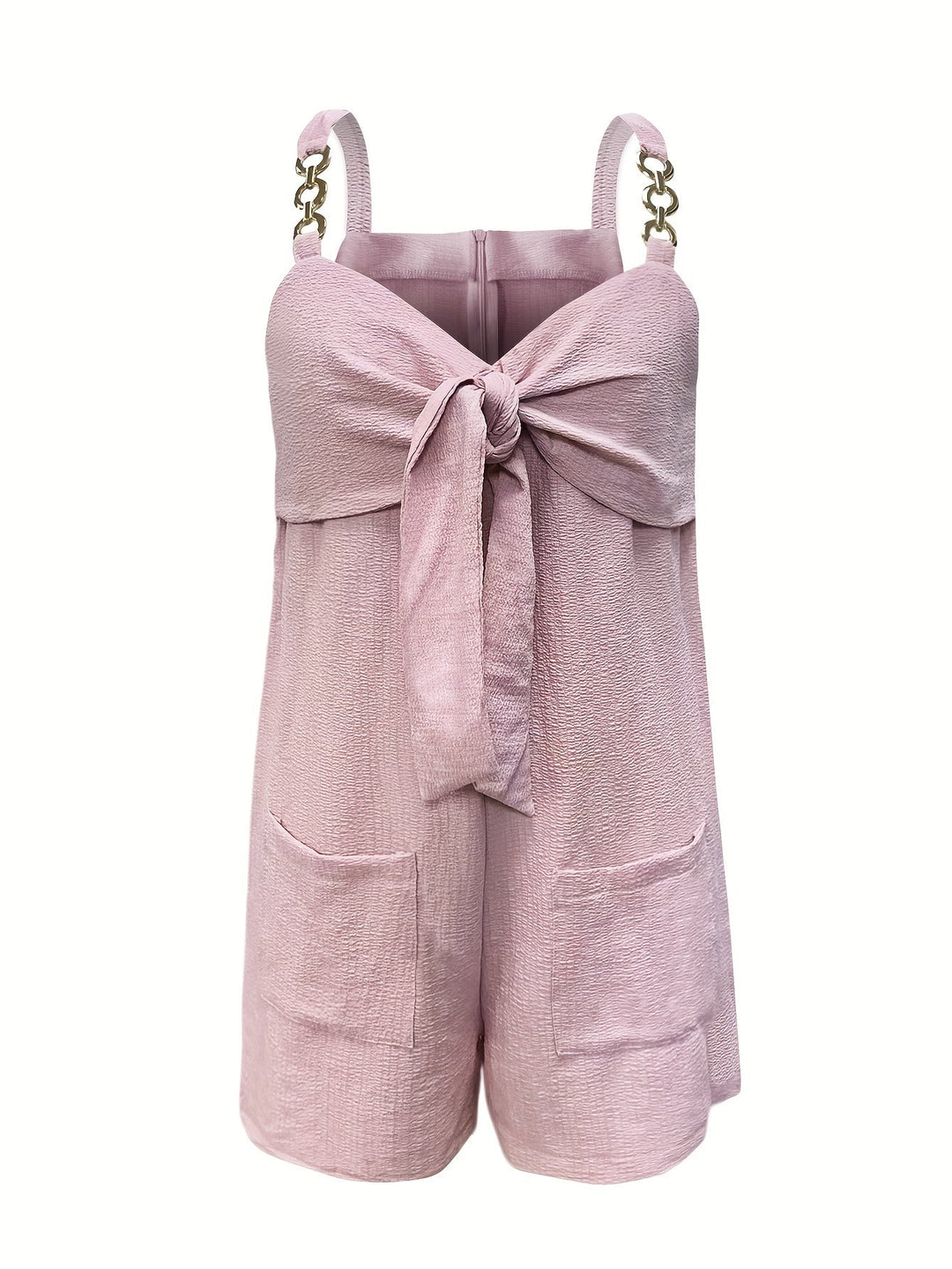 Women's summer textured romper styled with accessories, emphasizing chain straps, bow, and fashion appeal.