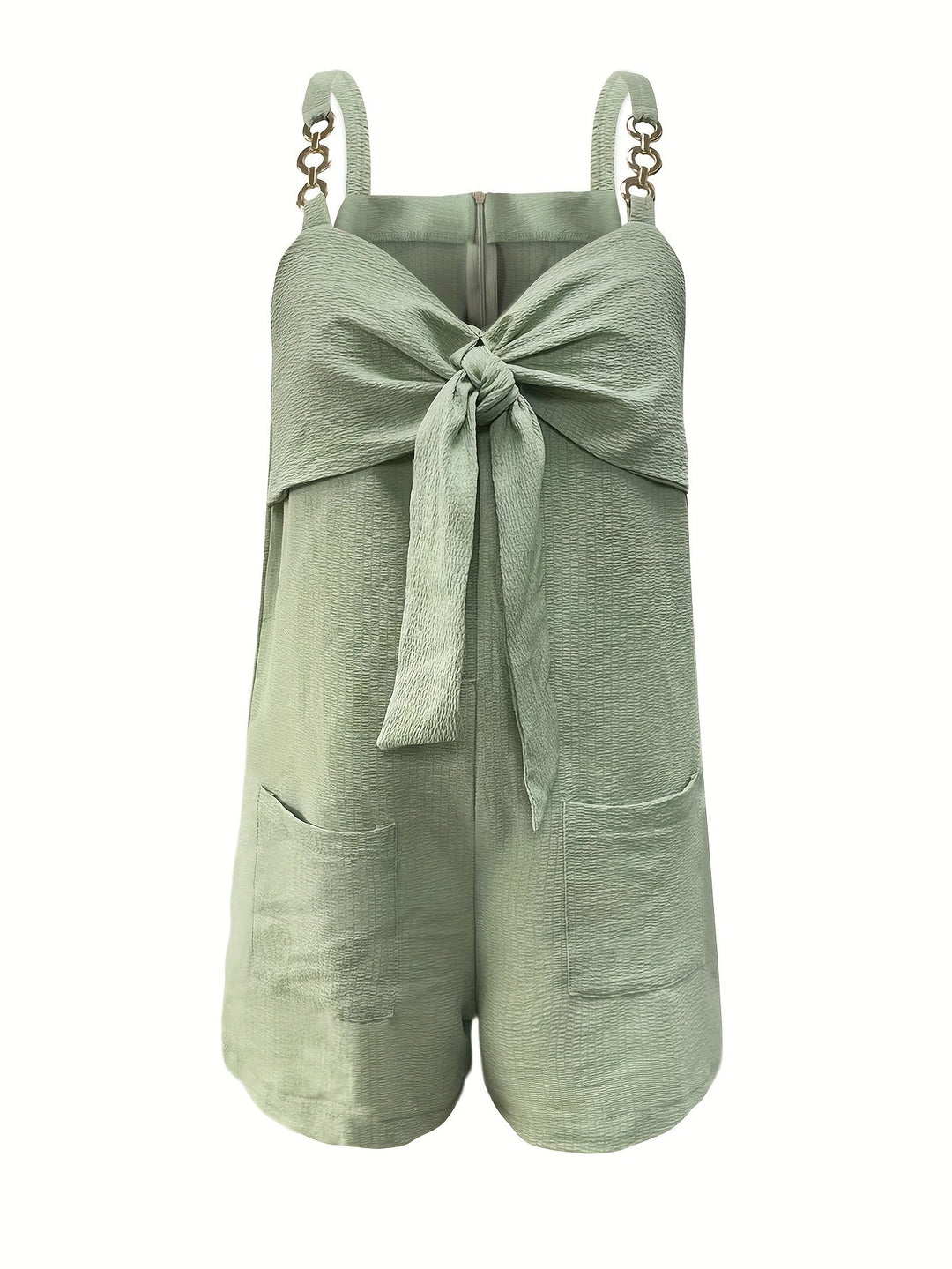 Elegant textured women's romper with chain straps & a bow front, perfect for a chic evening outfit or party.
