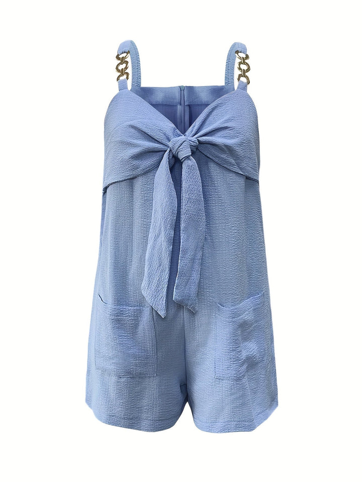 Stylish women's textured romper with chain straps & bow front, essential for your next vacation wardrobe.
