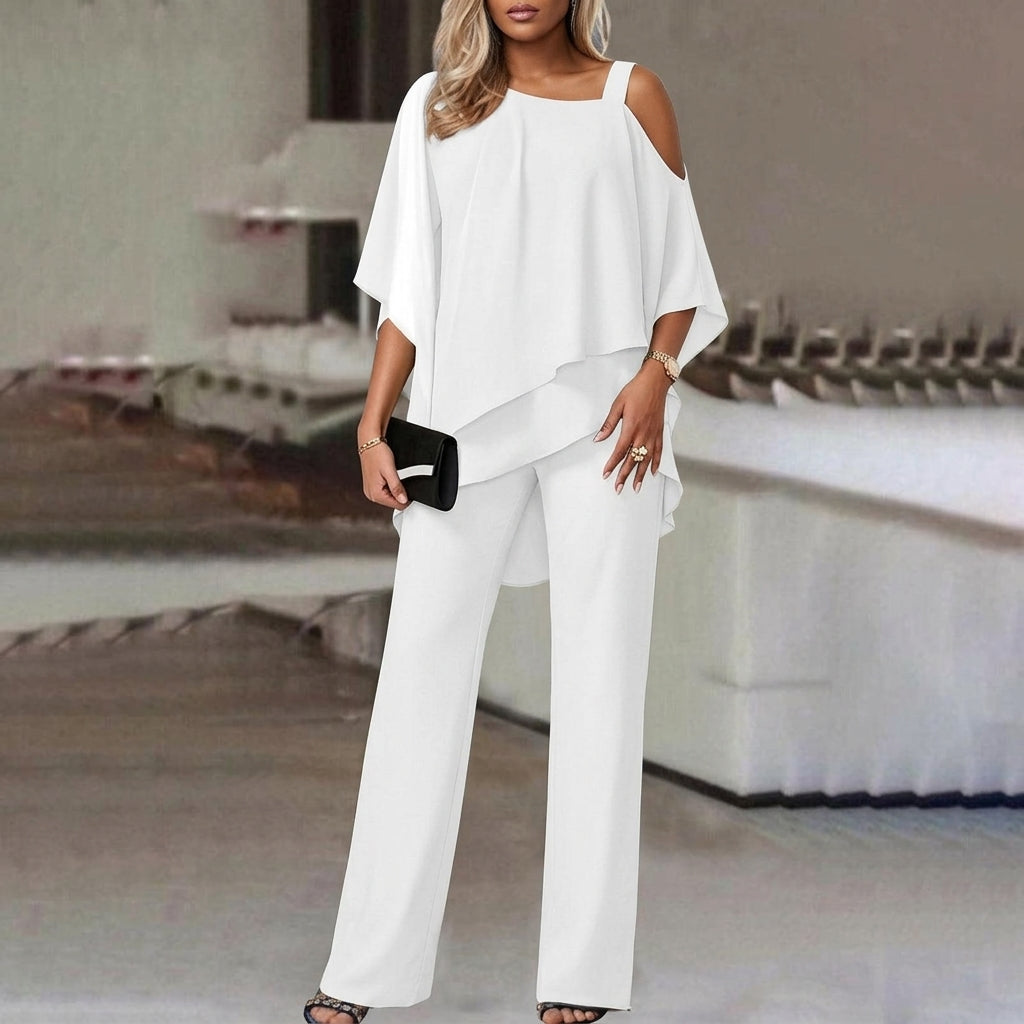 Elegant women's matching outfit: modern asymmetric top & straight leg pants. Perfect day to night office or casual wear.