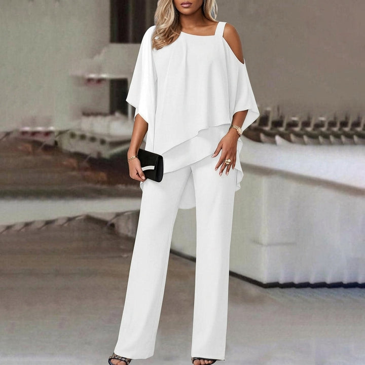 Elegant women's matching outfit: modern asymmetric top & straight leg pants. Perfect day to night office or casual wear.
