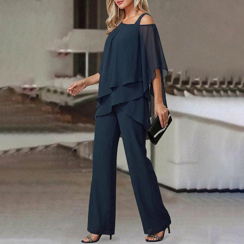 Fashionable women's two-piece set with an asymmetric top & straight leg pants. Versatile modern chic for elegant wear.