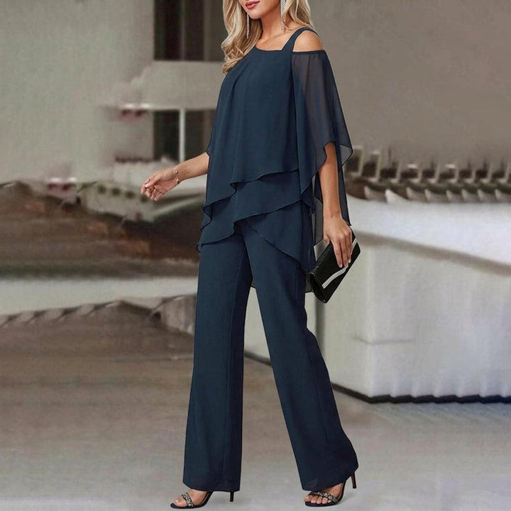 Fashionable women's two-piece set with an asymmetric top & straight leg pants. Versatile modern chic for elegant wear.