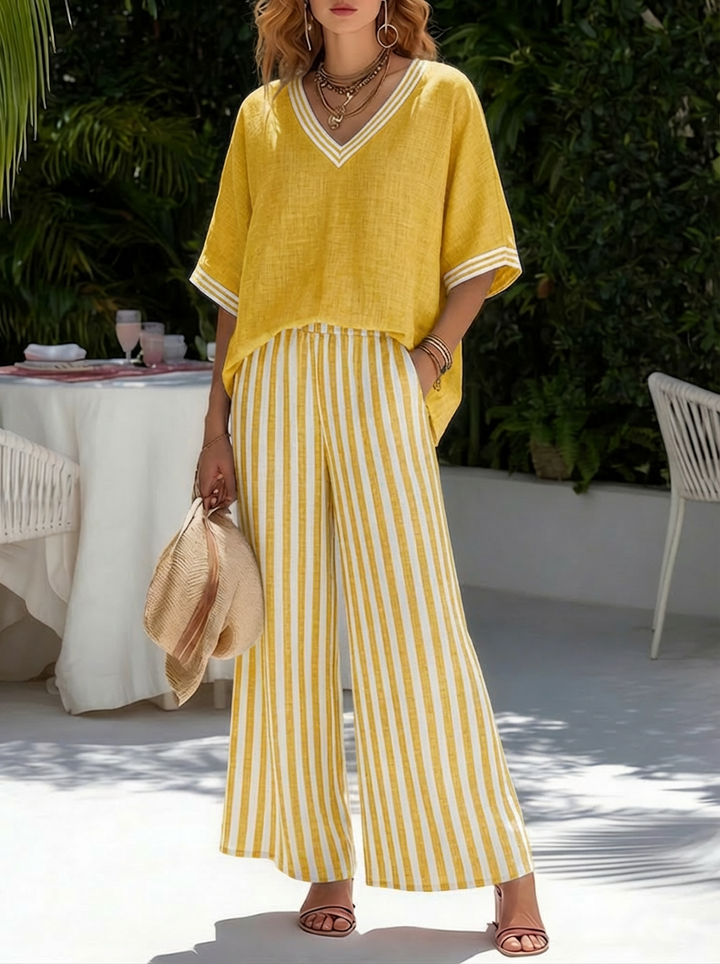 Full view of women's relaxed fit striped wide-leg pants, part of a chic two-piece summer outfit.