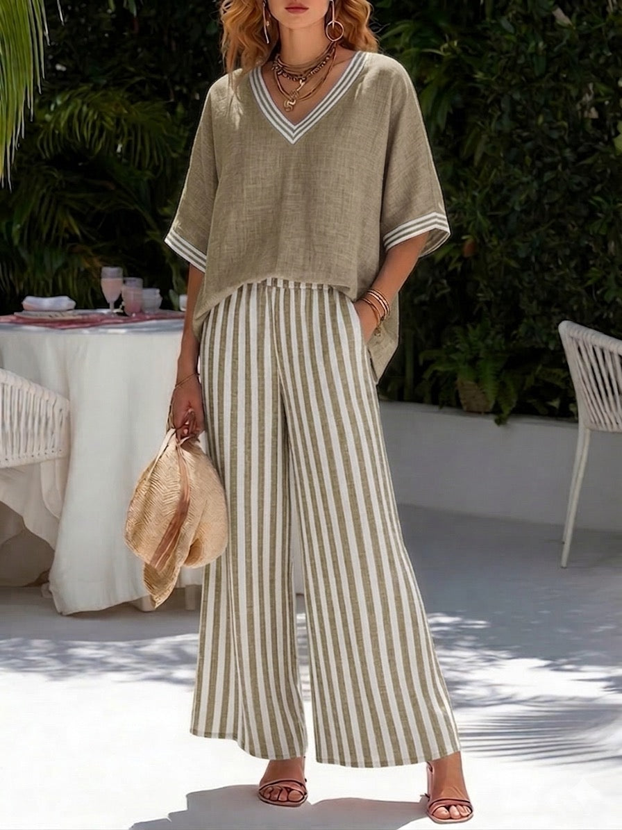 Stylish women's coordinating striped shirt & pants set, ideal for vacation, casual, or everyday wear.