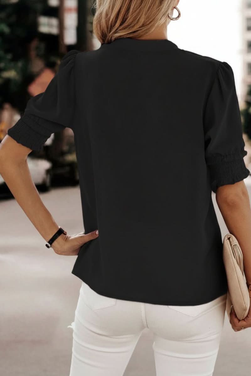 Flowy V-neck puff sleeve blouse for women. Comfortable & versatile, perfect for casual spring/summer outfits.