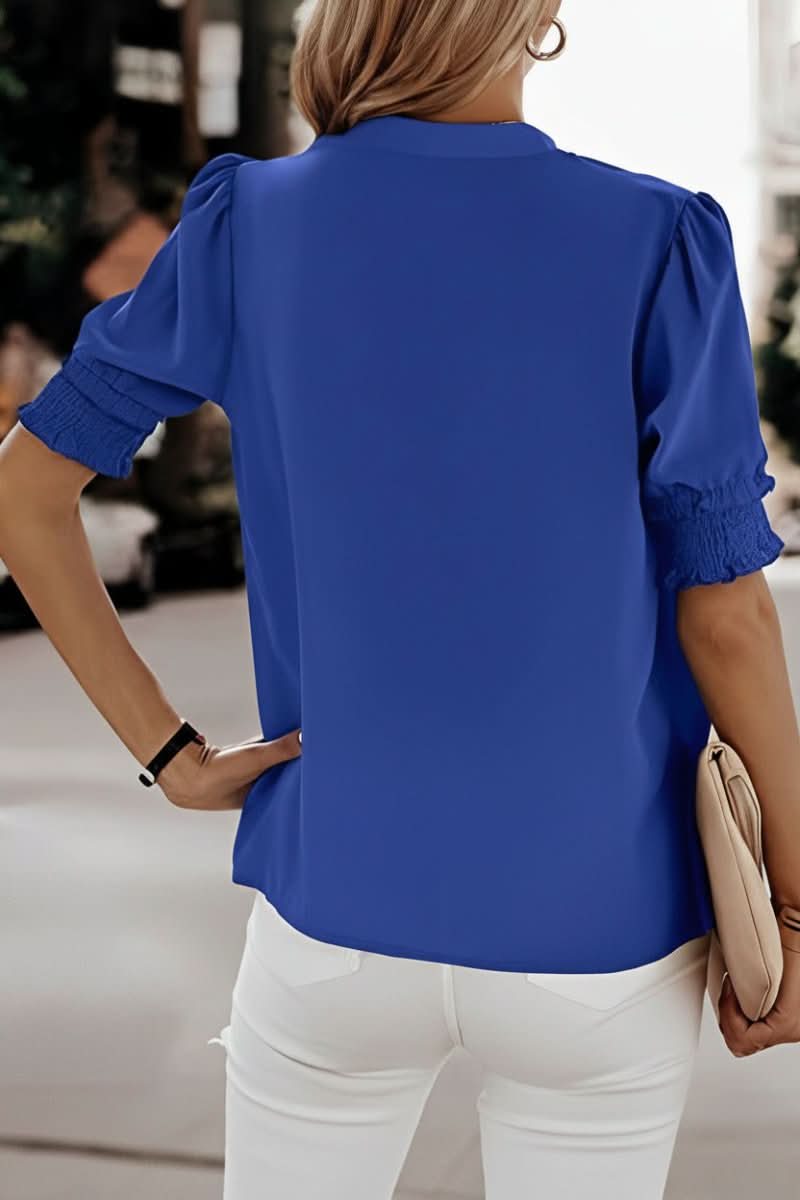 Elegant women's V-neck puff sleeve blouse. Chic short sleeve top, ideal for sophisticated spring & summer fashion.