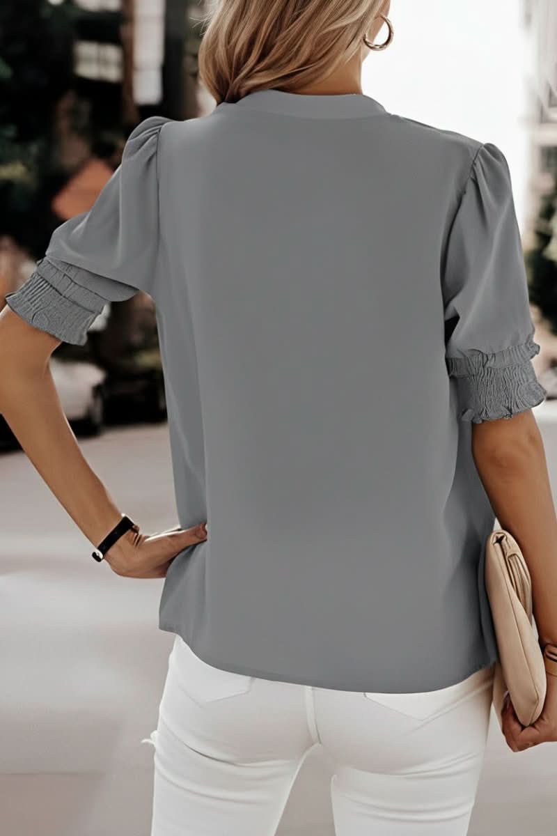 Women's V-neck blouse with elegant puff sleeves. Stylish & comfortable short sleeve top for everyday wear.