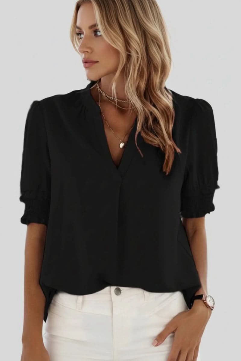 Comfortable women's V-neck blouse with chic puff sleeves. Elegant and flowy for easy spring/summer style.