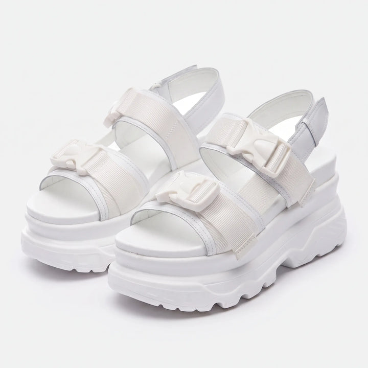 Bold women's chunky platform sandals, designed for streetwear with open toe and secure buckle straps.