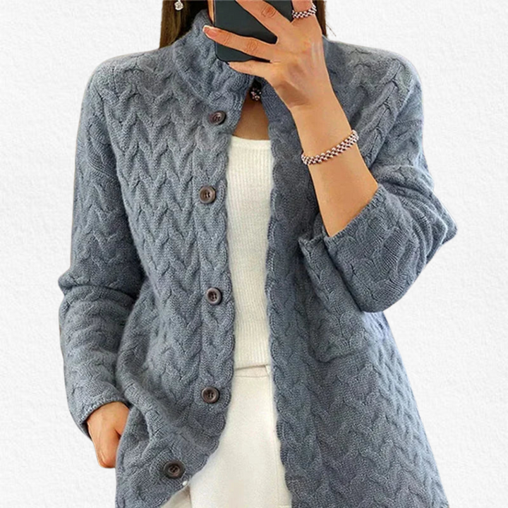 Chunky cable knit women's button cardigan with long sleeves. Soft, cozy knitwear for comfortable fall and winter casual wear.