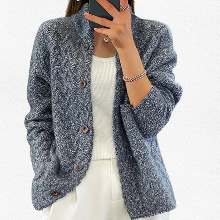 Stylish women's chunky cable knit button-front cardigan. Long sleeve, relaxed fit for cozy fall and winter fashion layering.